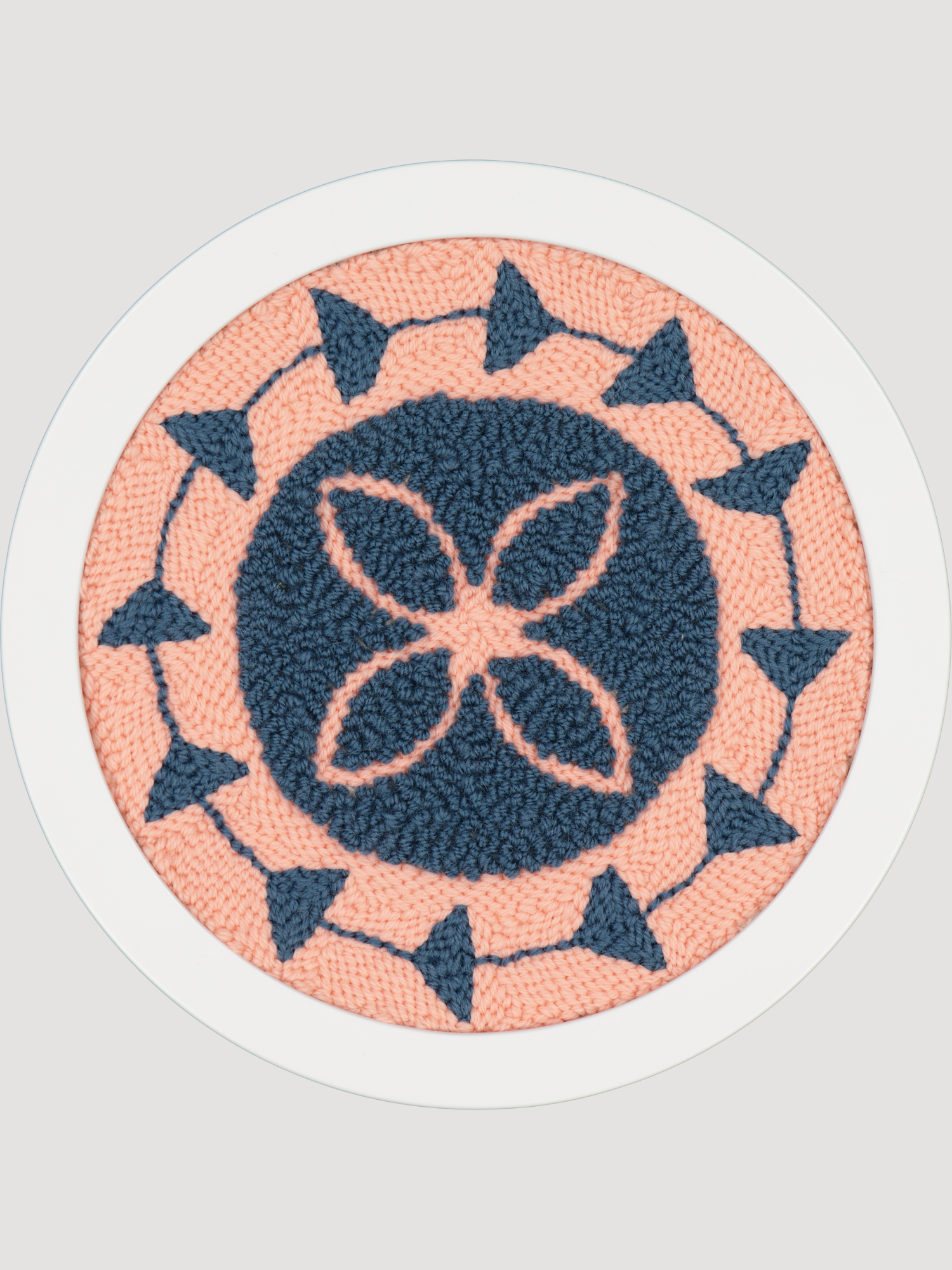 Round pink and navy polynesian inspired art piece