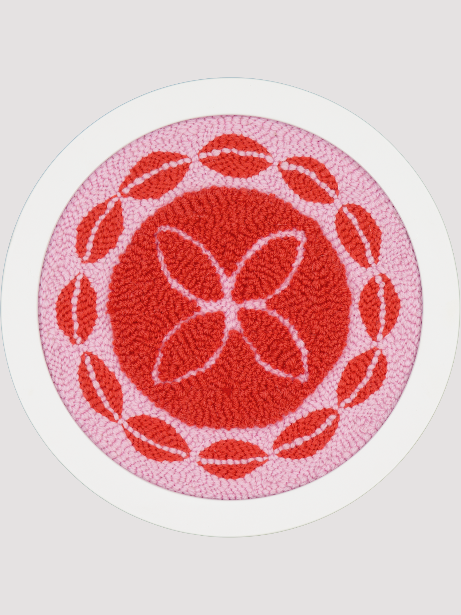 Round pink and red polynesian inspired artwork 