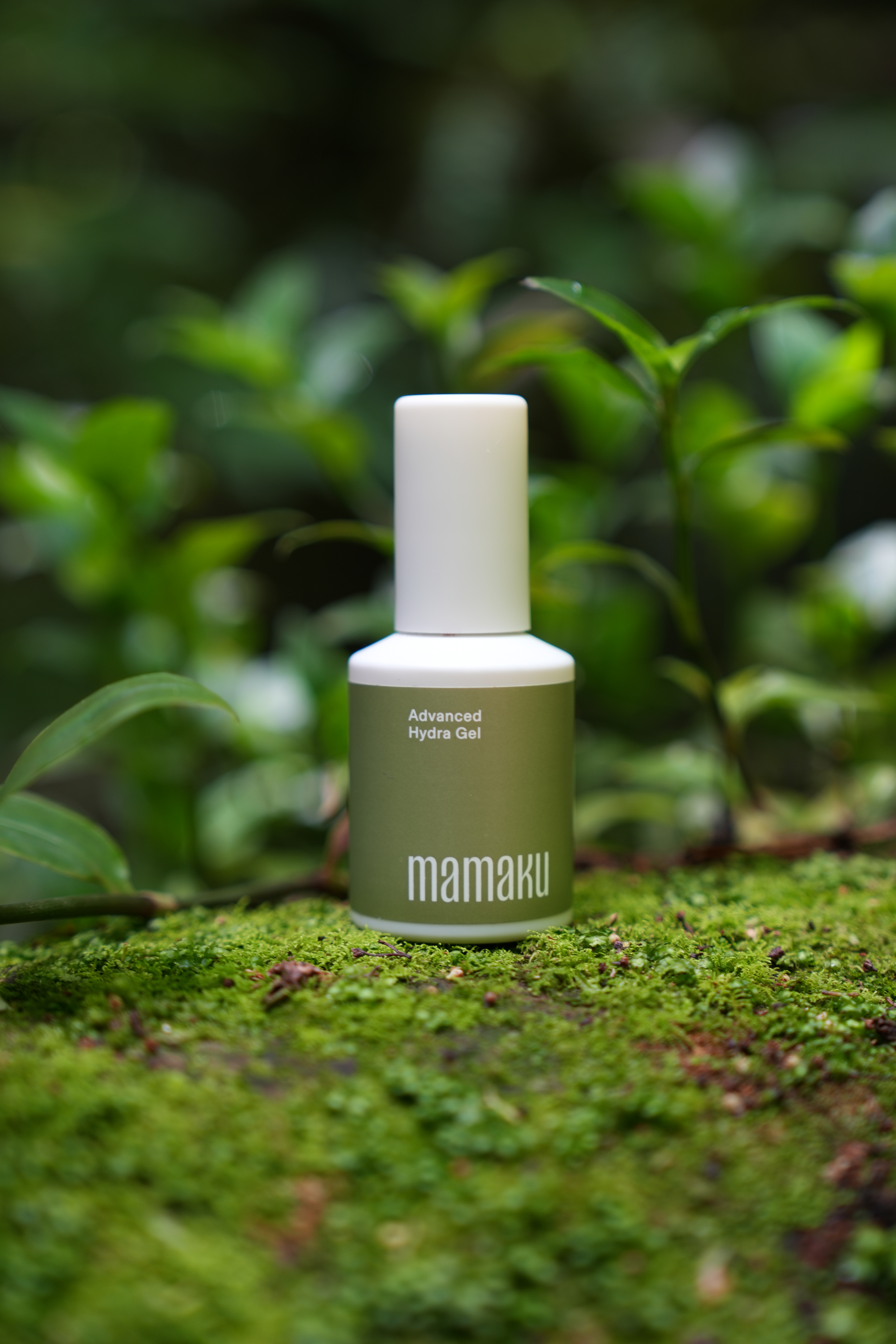 hydra gel bottle in green moss nature setting